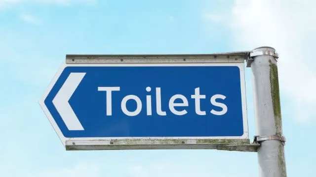 Signpost points to public toilets