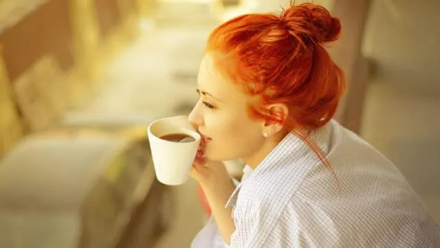 good morning womans with cup of fragrant coffee